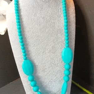 Turquoise Necklace of soft vinyl.
